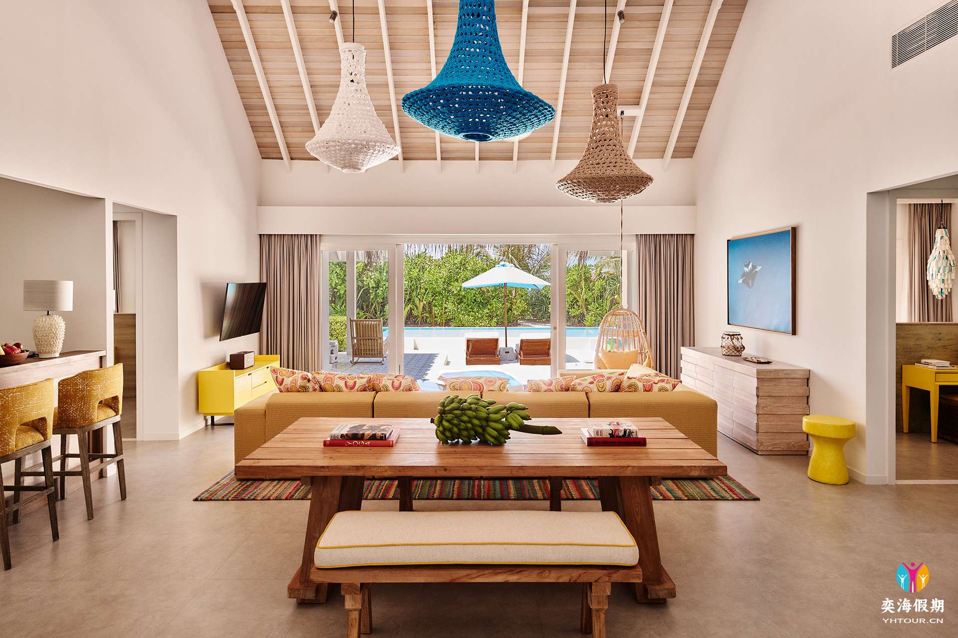 2103_Finolhu Maldives_Two-Bedroom Beach Pool Villa - Living Area with outdoor view.jpg