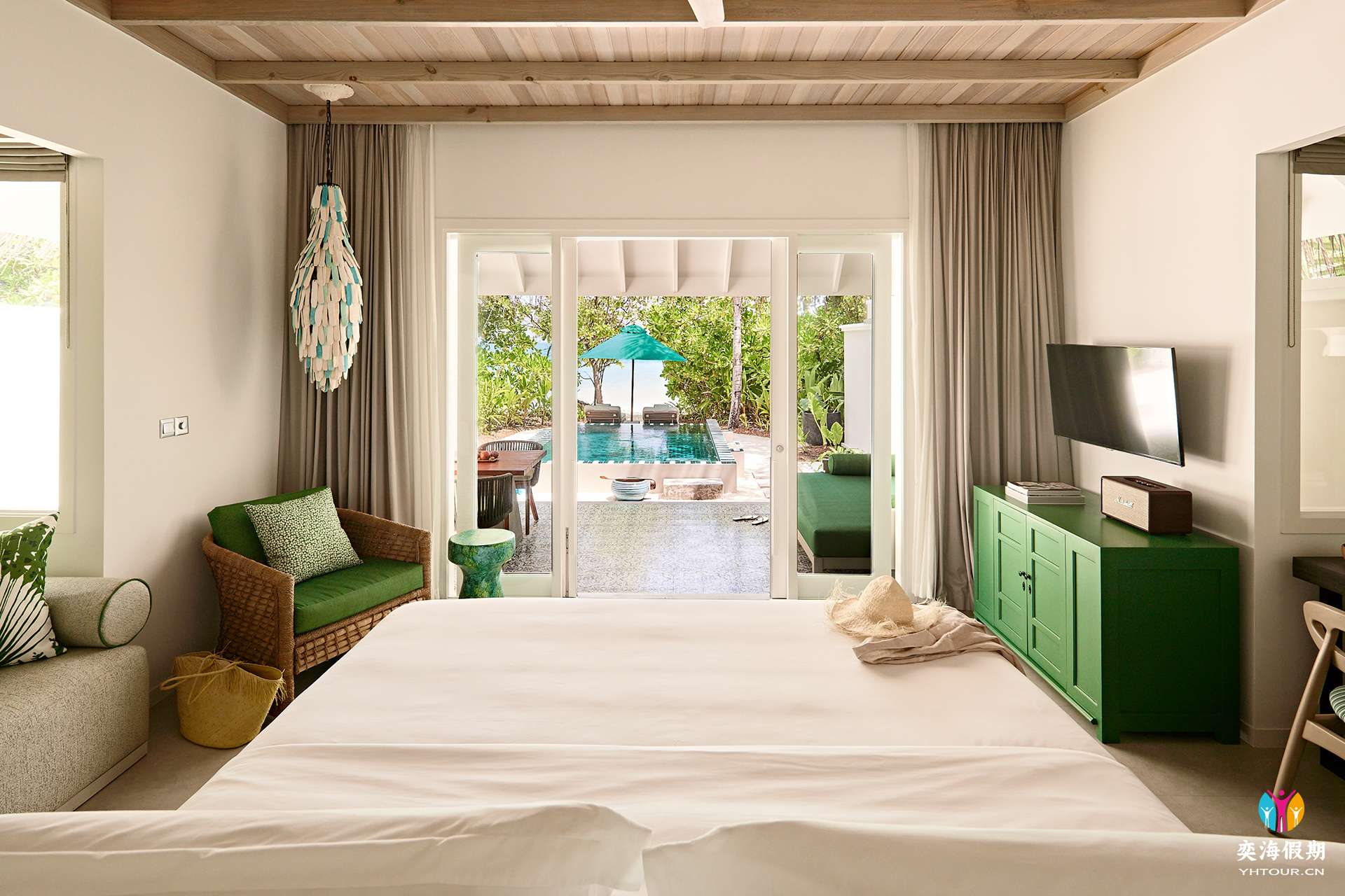 2103_Finolhu Maldives_Beach Pool Villa - Bedroom with outdoor view.jpg
