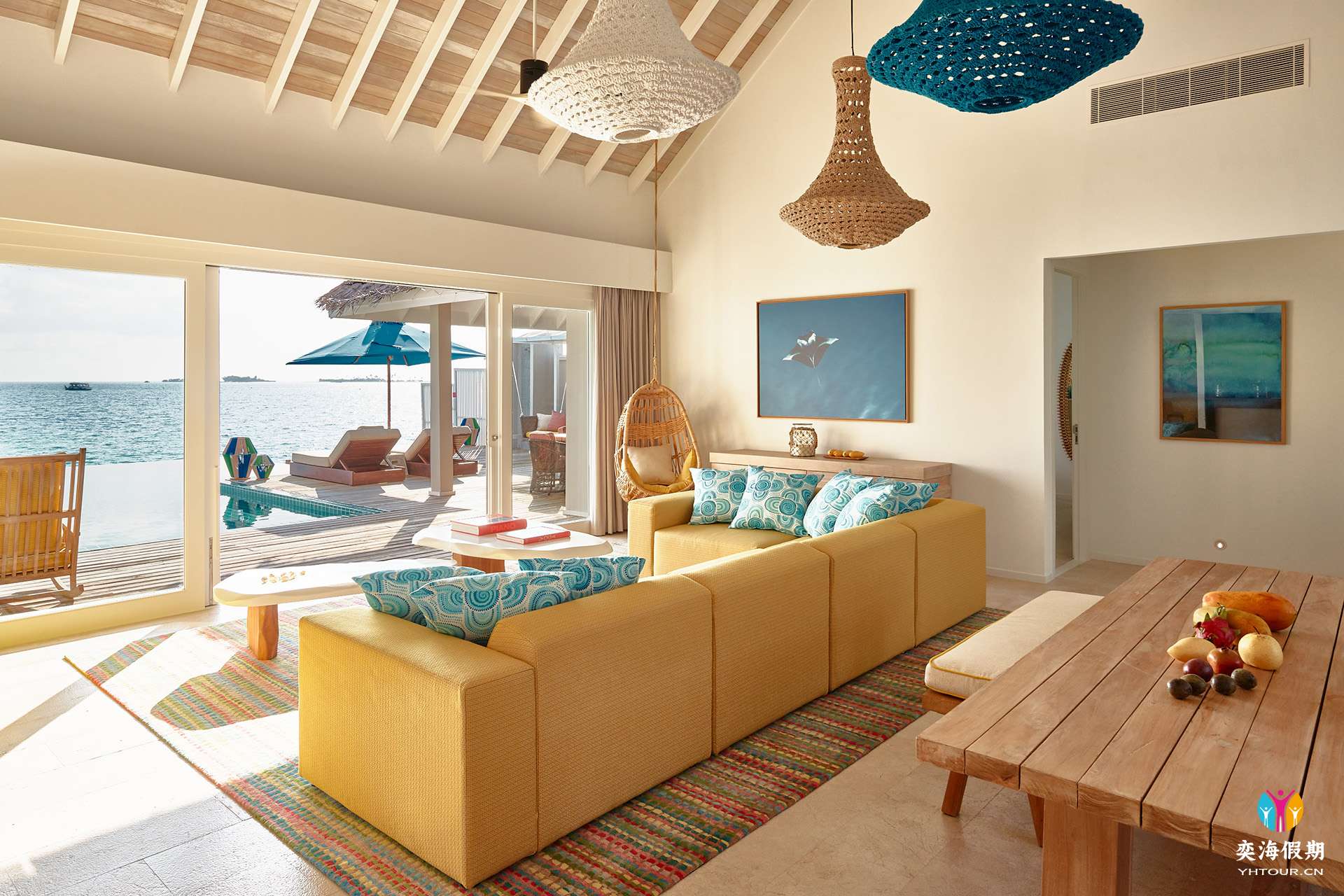 2103_Finolhu Maldives_Two-Bedroom Water Villa with Pool - Living Area with outdoor view.jpg